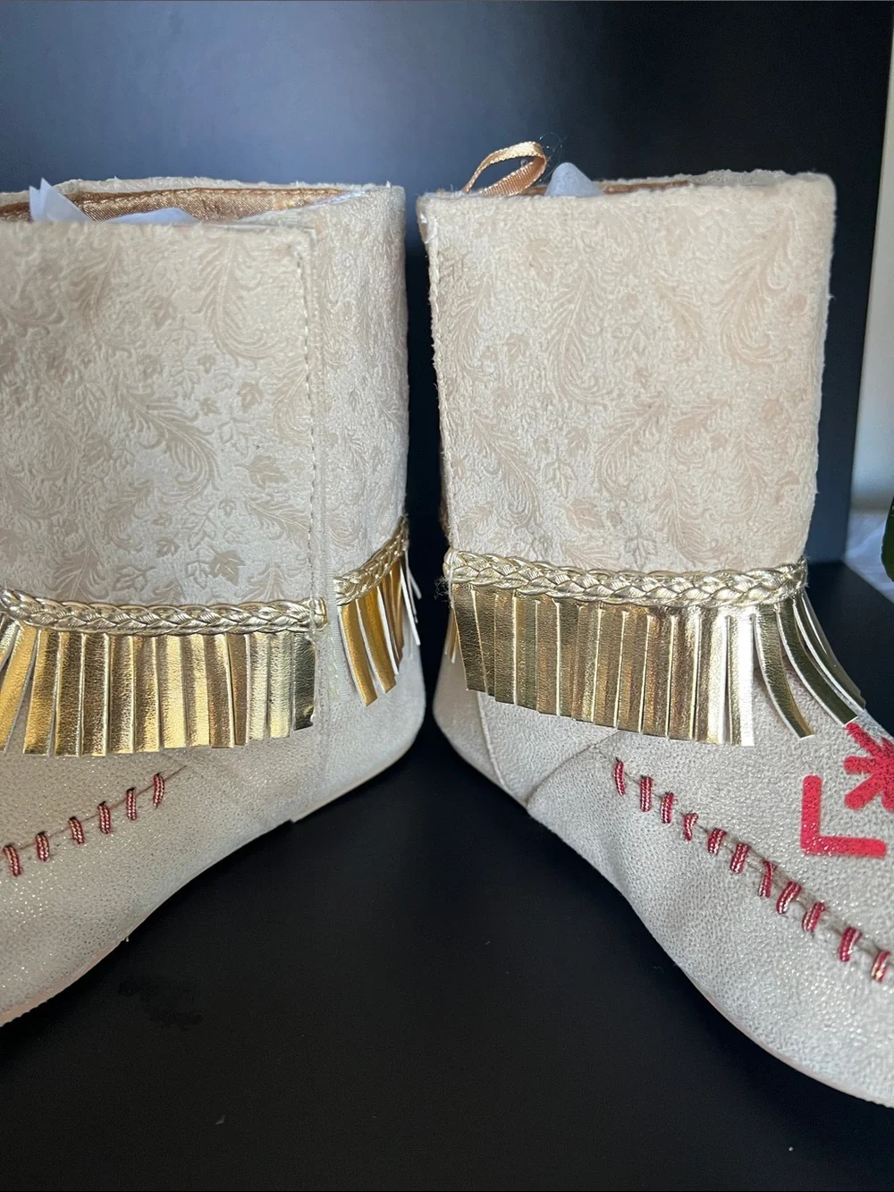 Disney Beige Moccasin Boots with Gold Fringe and Red Embroidery